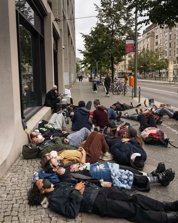 Die-in: people lying on a Berlin pavement